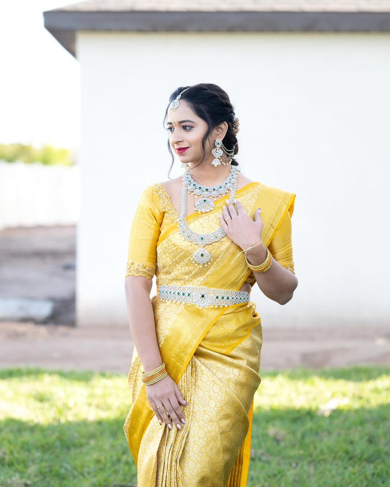 Indian bride in pink silk saree — bridal makeup by Varavi Tampa